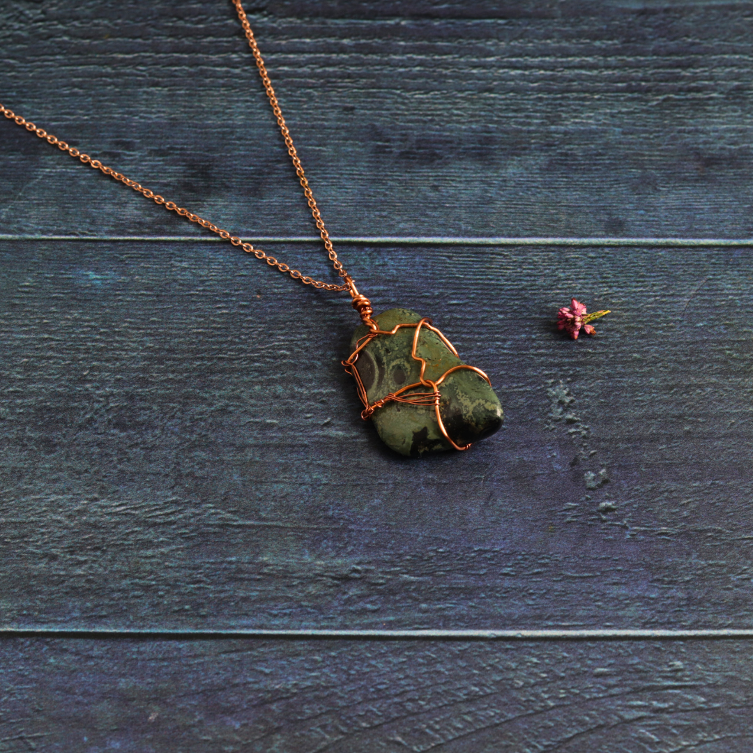 Rose gold wrapped nebula stone
