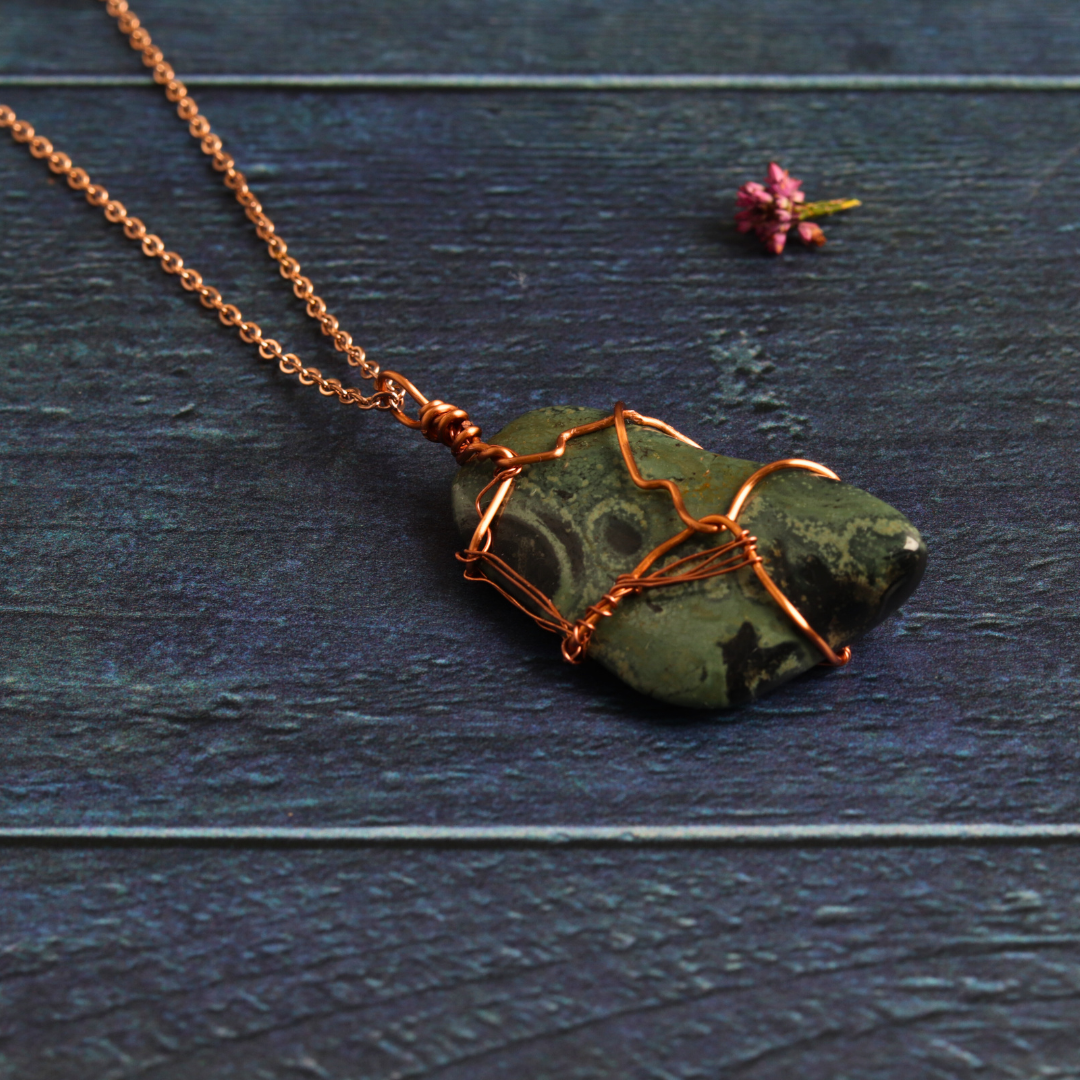 Rose gold wrapped nebula stone